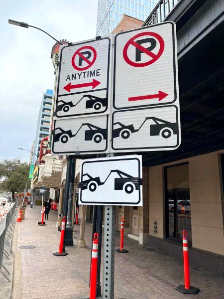 This signs on a No parking sign