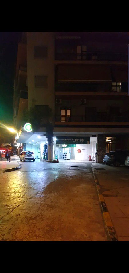 Apartment building with a gas station on the ground floor